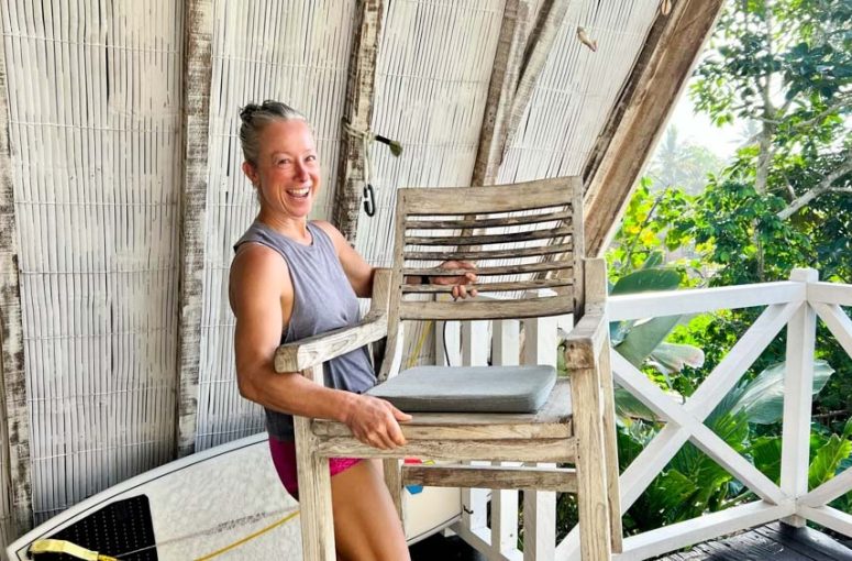 Woman is happily getting rid of furniture.