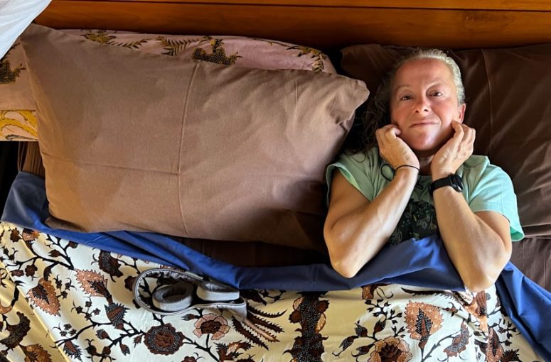 A woman experiencing discomfort caused by nighttime teeth grinding.