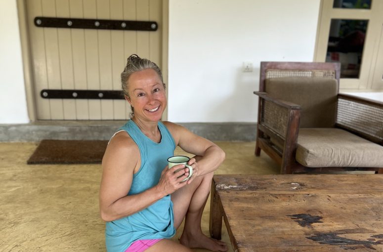 Woman sitting on the floor.